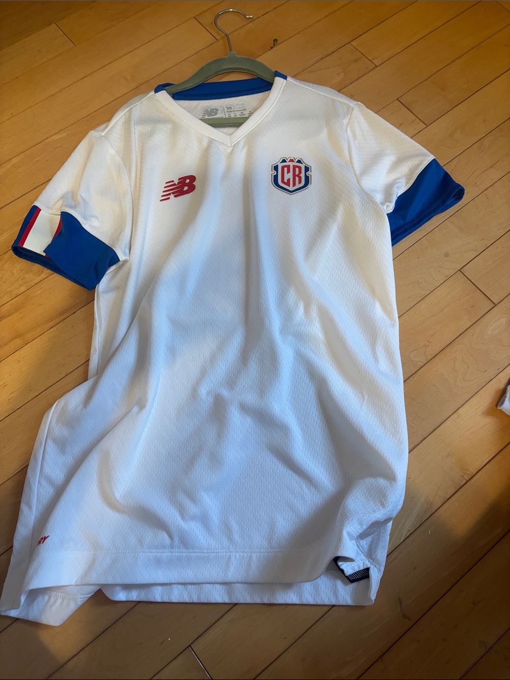 New Balance Kids Costa Rica Soccer Jersey with Blue Trim and Red Logo